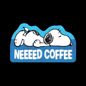 May include: A sticker featuring a white cartoon dog lying down on a textured blue background. The dog has black outlines and a black ear. Below the dog, the white text reads NEEEED COFFEE in a bold, sans-serif font. The sticker has a wavy edge.