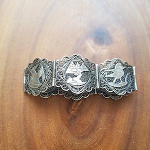 Filigree panel egyptian revival silver bracelet 1920s