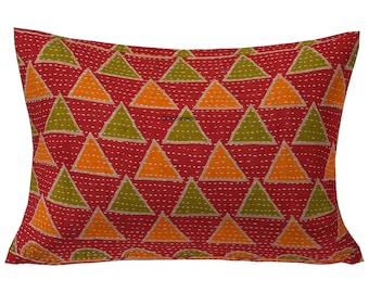 May include: Rectangular red pillow with a repeating pattern of orange and green triangles. The triangles are evenly spaced and stitched with white thread. The pillow is a decorative home accent.