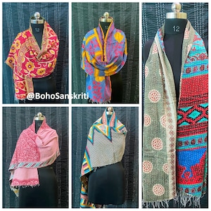 May include: Six different colourful kantha quilts, each with a unique pattern and design, are displayed on mannequins. The quilts are made from recycled saris and are perfect for adding a touch of bohemian style to any home.