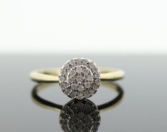 Diamond Daisy Cluster Elevated Ring. 10k Yellow gold with round diamond Cluster arrangement. st(47)