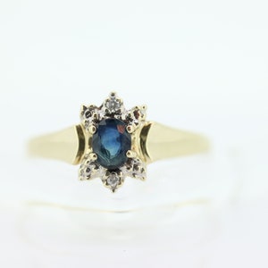 10k Blue Sapphire and Diamond Halo ring. 10k Oval Sapphire Diamond Halo ring. st(89)