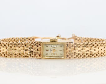 Orologio meccanico Baume e Mercier Geneve in oro 14k. Bracciale/cinturino Panther in oro 14k.