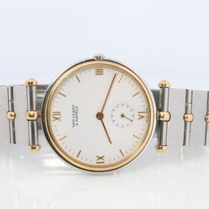 Van Cleef and Arpels 416 604 B4 Watch. La Collection 18k Ss Round 32mm Watch