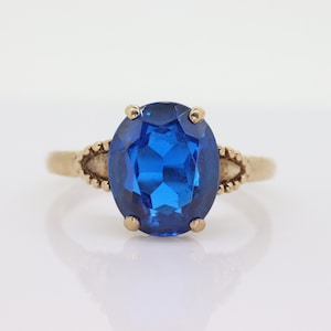 10k Oval Blue Spinel ring. 10k Yellow Gold Blue Spinel Solitaire Ring st98