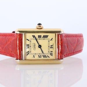 Vintage Must De Cartier tankhorloge met gouden wijzerplaat. Vermeil Argent kleine tanktop