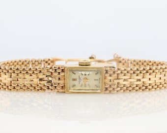 14k Baume and Mercier Geneve Mechanical Watch. 14k Panther Bracelet/Band.