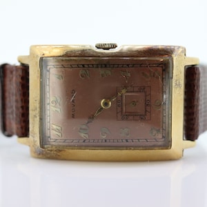 14k MOVADO Rectangle Manual Watch. Antique Mens Movado Vintage Tank Wrist Watch with a second hand. st(414)