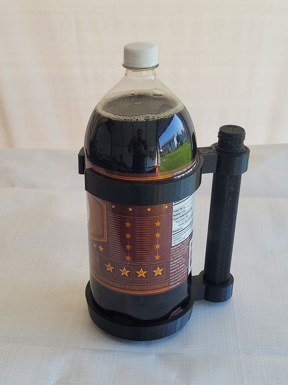 2 liter soda bottle holder - for when cans of pop just aren't enough! Soda is cheaper in bigger bottles. Excellent conversation starter.