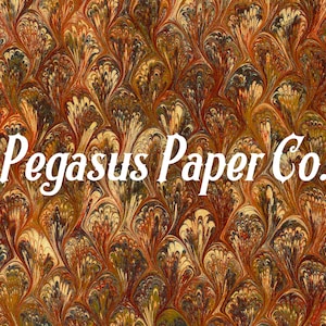 May include: A close-up of marbled paper with a peacock feather pattern in shades of brown, orange, yellow, and white. The text "Pegasus Paper Co." is printed in white on the paper.