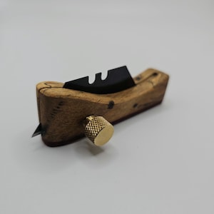 Guitar binding scraper
