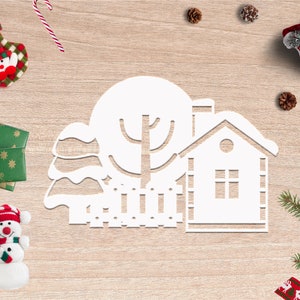May include: White paper cut-out of a winter scene with a house, tree, and fence. The scene is surrounded by Christmas decorations, including a stocking, candy canes, pine cones, and a snowman.