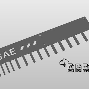 May include: A gray metal SAE wrench holder with 15 slots for wrenches. The holder has the letters "SAE" printed on it.