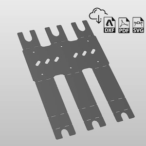 May include: A gray cardboard template for a box with three slots. The template has cut-out lines for folding and tabs for gluing.