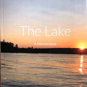 May include: A book cover with the title "The Lake" and the subtitle "A Marston Book" by Jennifer Poore. The cover features a sunset over a lake with a silhouette of trees in the foreground.