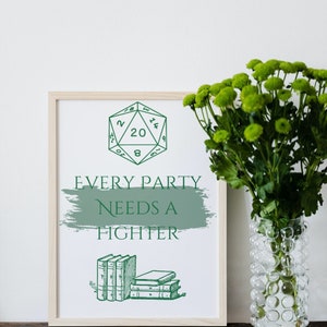 May include: A framed print with a green 20-sided die and the text "Every party needs a fighter". The print is on a wooden table with a vase of green flowers.