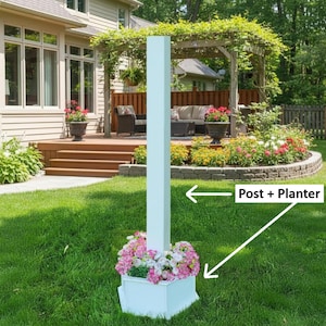 May include: A white post with a square planter base filled with pink and white flowers. The post is in a grassy yard with a house and patio in the background. The text "Post + Planter" is in the image.