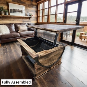 May include: A rustic wooden coffee table with a lift-top mechanism. The table has a distressed finish and is made from reclaimed wood. The table is fully assembled and ready to use.  "Fully Assembled" is written in white text on the bottom of the image.