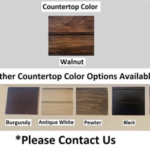 以下が含まれることがあります： Walnut、Cherry、Burgundy、Antique White、Pewter、Black、Rich Tobaccoのカウンタートップ仕上げを示すカラーチャート。各サンプルには木目調のテクスチャと水平の溝があります。テキストにはCountertop ColorおよびOther Countertop Color Options Available *Please Contact Usと記載されています。