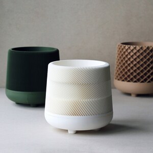 Curated visual reference: Visual Reference: White Planters With Zig Zag Line Pattern And Saucer Plates