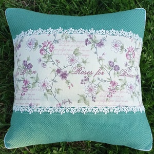 Decorative pillow in French vintage style, pink flowers, lilac, shabby chic, menthol faux burlap, lace, country style, floral fabric, roses