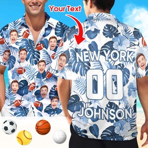 May include: A short-sleeved button-down shirt with a white background and a blue floral pattern. The shirt features the text "NEW YORK" and "JOHNSON 00" on the back. The shirt also has a repeating pattern of faces and footballs.