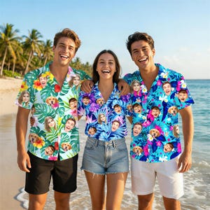May include: Three short-sleeved button-down shirts featuring a tropical pattern of green palm leaves, pink and yellow hibiscus flowers, and repeating photographic portraits of faces and dogs printed across the fabric in blue and white tones.