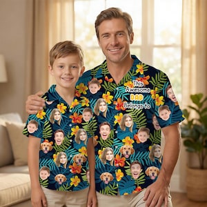 May include: Matching short-sleeved button-down shirts with a tropical floral and leaf pattern in navy blue, yellow, and orange. The shirts feature personalized faces and the text "This Awesome DAD Belongs to".