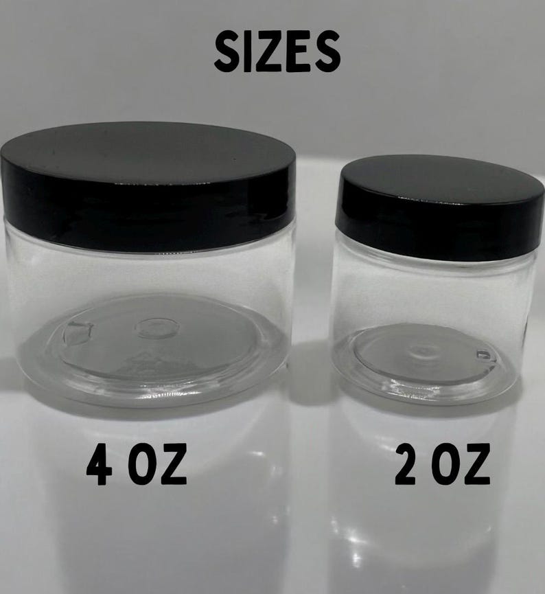 May include: Two clear plastic jars with black lids. The larger jar is labeled "4 oz" and the smaller jar is labeled "2 oz".