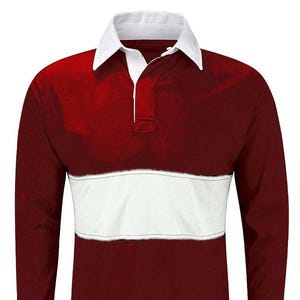 May include: A long-sleeved rugby shirt with a white collar and a white band across the chest. The shirt is burgundy with a white label that says "Autumn Sports Super League".
