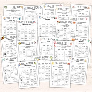 May include: A collection of white paper game sheets titled "Roll a Story" with various themes like Adventure, Christmas, and Halloween. Each sheet features dice and prompts to create a story. The sheets are arranged on a light-colored wooden surface.