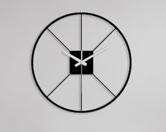 Reloj de pared circular de metal minimalista, moderno, negro, silencioso, hecho a mano, con acento interior contemporáneo.
