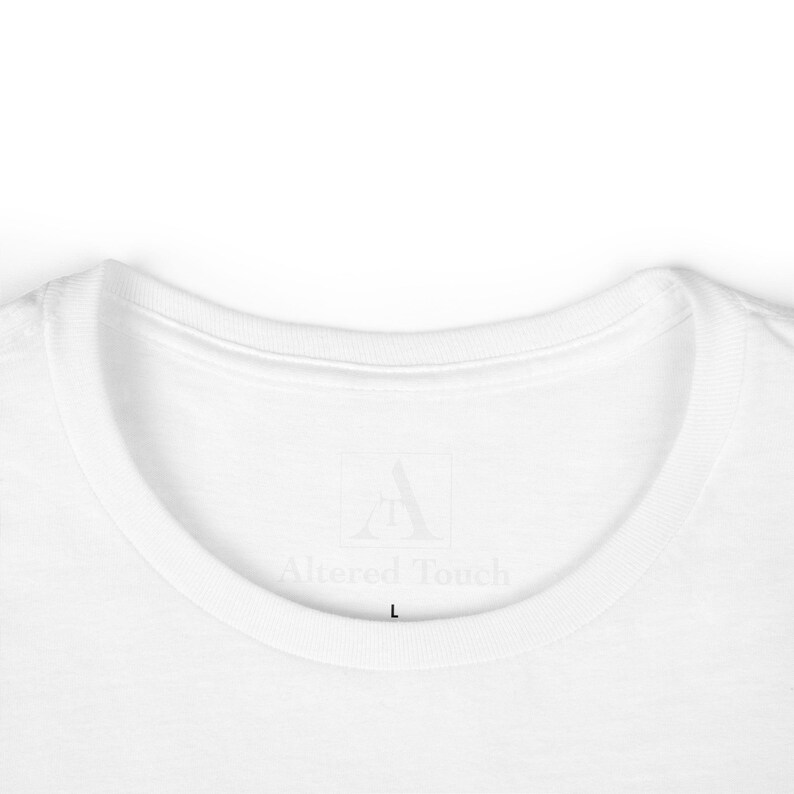 May include: White t-shirt with a white label that says "Altered Touch" and a size "L" printed on it.