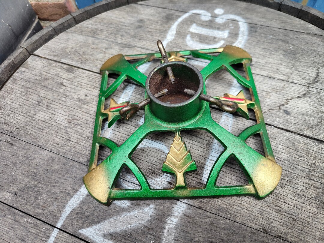 Old Small Christmas Tree Stand , Cast Iron Green With Some Gold and Red Accents Decorated With