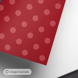 May include: Red paper with a white polka dot pattern.