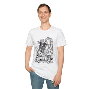 May include: A white short-sleeve t-shirt featuring a black and white graphic print of a person in a suit riding a shopping cart on a roller coaster track. The text TARIFF WHIPLASH PAUSE, REVERSE, REPEAT is printed below the illustration.