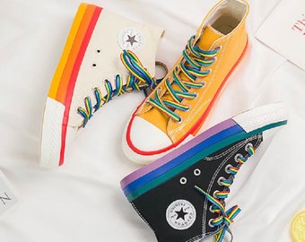 white converse rainbow bottom