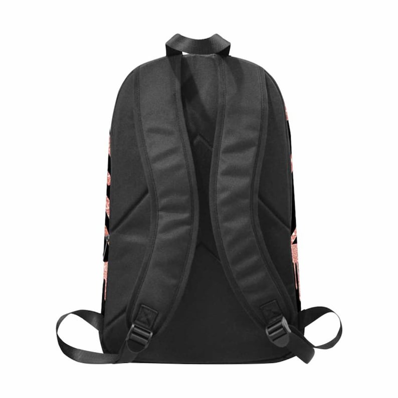 May include: Black backpack with adjustable straps. The backpack has a rose gold design on the sides.