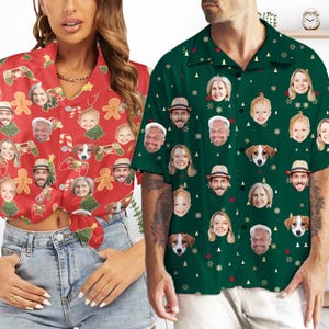 May include: Two Christmas themed button-up shirts with a green and red background. The shirts feature a repeating pattern of faces, Christmas trees, and snowflakes.