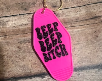 Neon pink motel keychain