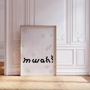 May include: A white hexagonal tile wall with a black pixelated word "mwah!" in the center. The tiles have small pastel colored flowers scattered throughout.