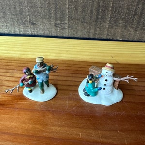 Dept 56 heritage village playing in the snow