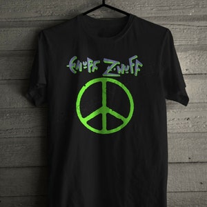 May include: Black t-shirt with a green peace sign and the text """nuff Znuff" in purple.