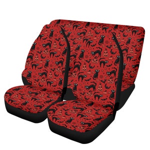 May include: Set of three red and black Halloween car seat covers featuring a pattern of black cats, pumpkins, and bats.