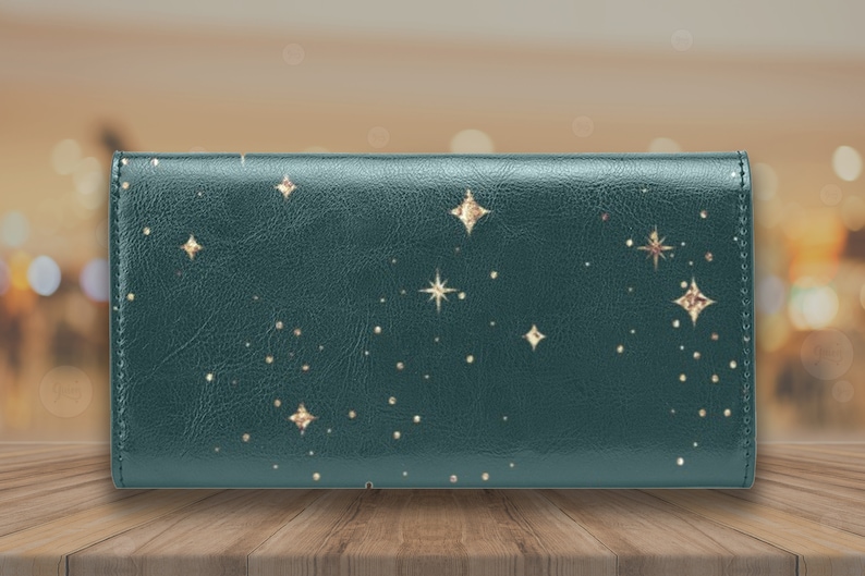 May include: A dark green leather wallet with a gold star pattern.