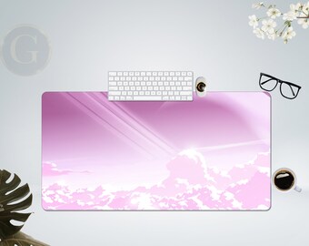 May include: Pink and white desk mat with a cloudy sky design. The mat is made of a soft, durable material and is perfect for protecting your desk from scratches and spills.