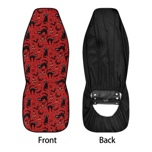 May include: A red and black Halloween-themed car seat cover with a pattern of black cats, pumpkins, and bats. The back of the cover is black.