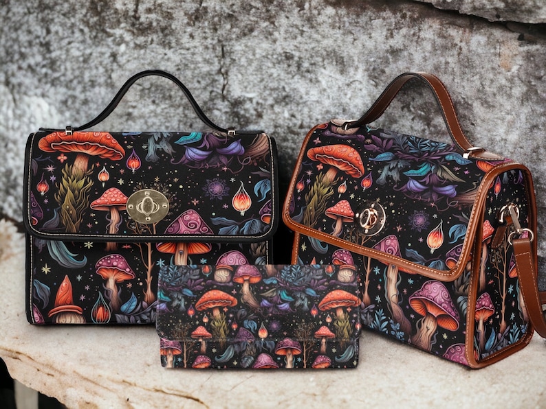 May include: Three black and brown handbags with a mushroom and floral print. The largest bag has a top handle and a flap closure. The medium bag has a top handle and a shoulder strap. The smallest bag is a clutch.