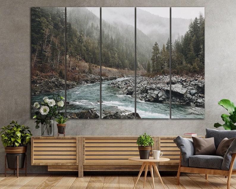 May include: A panoramic landscape photograph of a river flowing through a lush forest. The river is a vibrant blue-green color and the forest is a deep green. The image is split into five sections, creating a triptych effect.