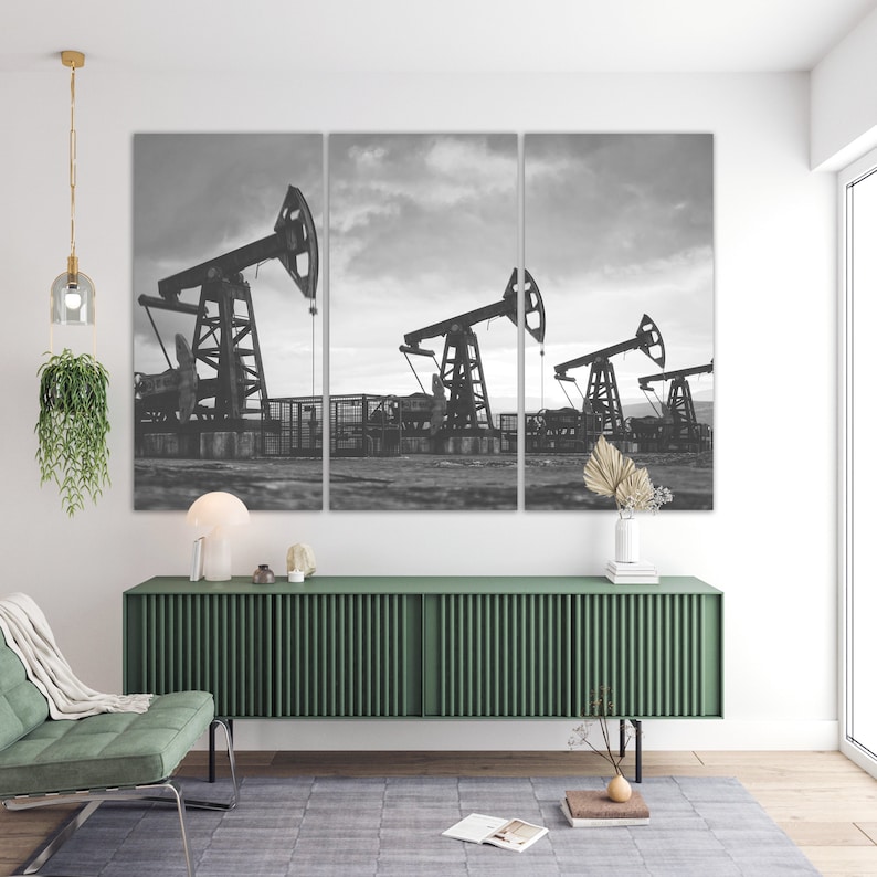 May include: A black and white photo of three oil derricks pumping oil in a field. The photo is split into three panels.